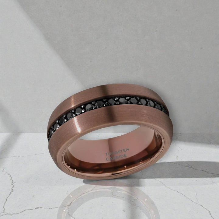 Side view of Artemis espresso tungsten ring showing brushed finish and gemstone band