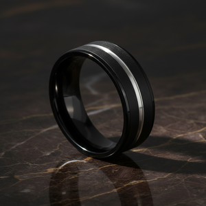 ASHCHIL — Luxury 3/4 angle on dark marble — men's tungsten wedding ring.