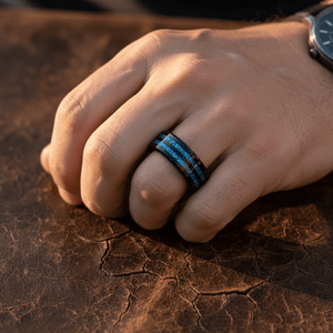 ASHEN — Lifestyle photo on hand — men's tungsten wedding ring.