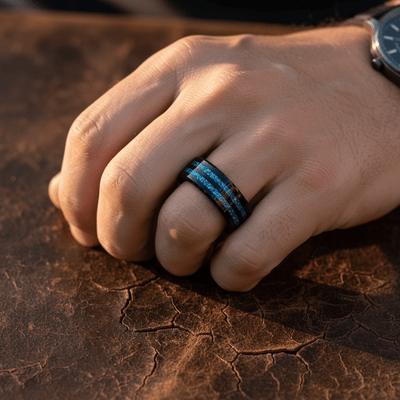 ASHEN — Lifestyle photo on hand — men's tungsten wedding ring.
