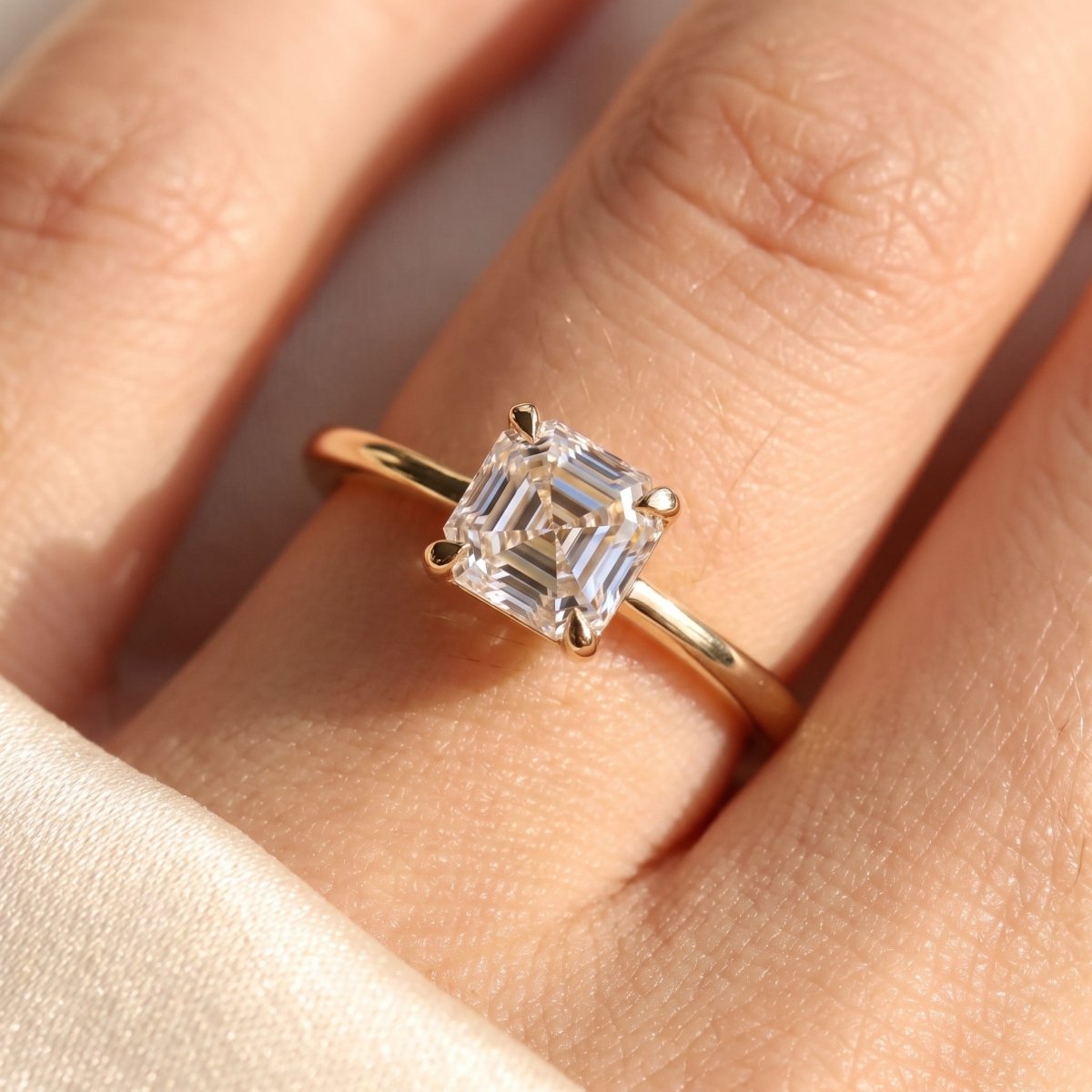 Asscher lab-grown diamond solitaire engagement ring, Yellow Gold, on-finger close-up