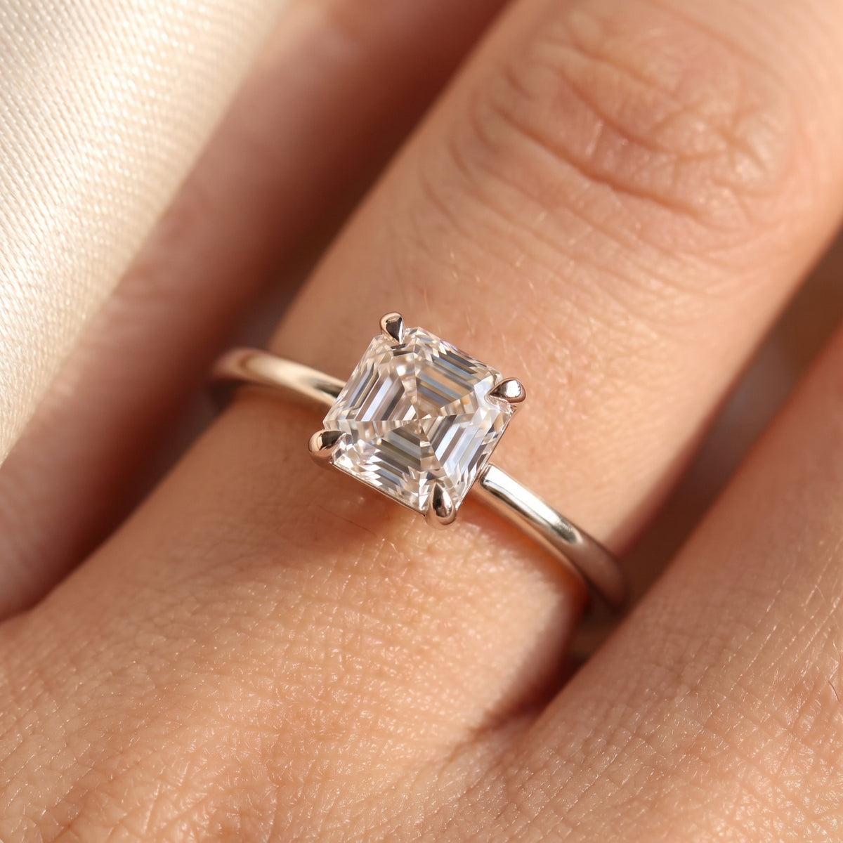 Asscher lab-grown diamond solitaire engagement ring, 925 Sterling Silver, on-finger close-up