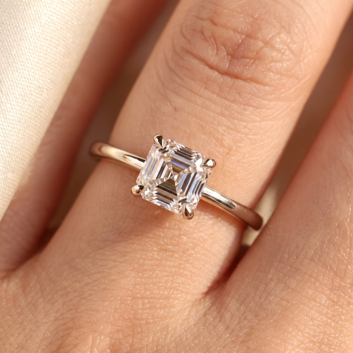 Asscher lab-grown diamond solitaire engagement ring, White Gold, on-finger close-up