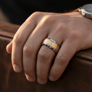 AUREON — Lifestyle photo on hand — men's tungsten wedding ring.