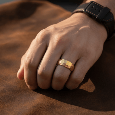 AURIGA — Lifestyle photo on hand — men's tungsten wedding ring.
