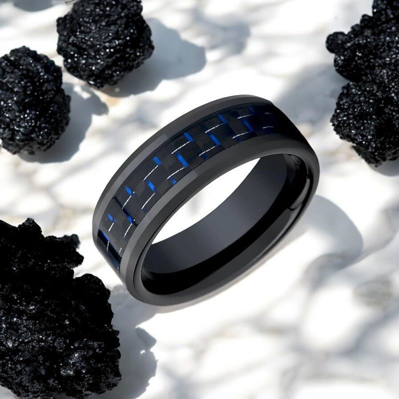 Side view of the AVITUS Ceramic Ring showcasing the blue and black carbon fiber inlay.