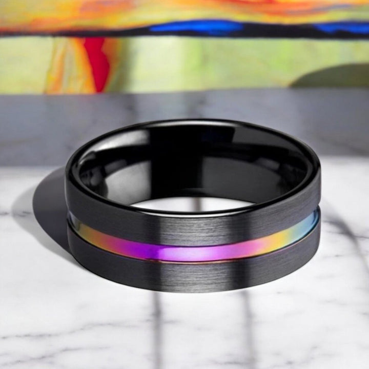 Stylish black ceramic wedding band with brushed flat finish and eye-catching rainbow detail - Aydins Jewelry.