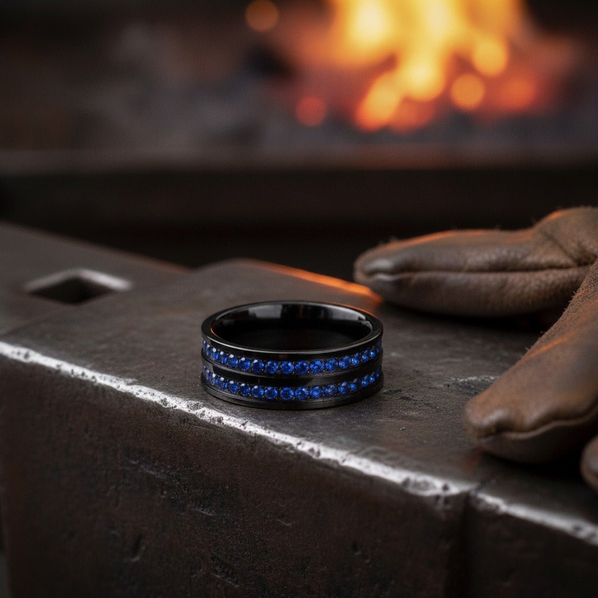 Aydins AZURON | Black Tungsten Ring Double Row Diamond Stimulated Blue CZ Eternity, 8mm lifestyle scene, blacksmith forge