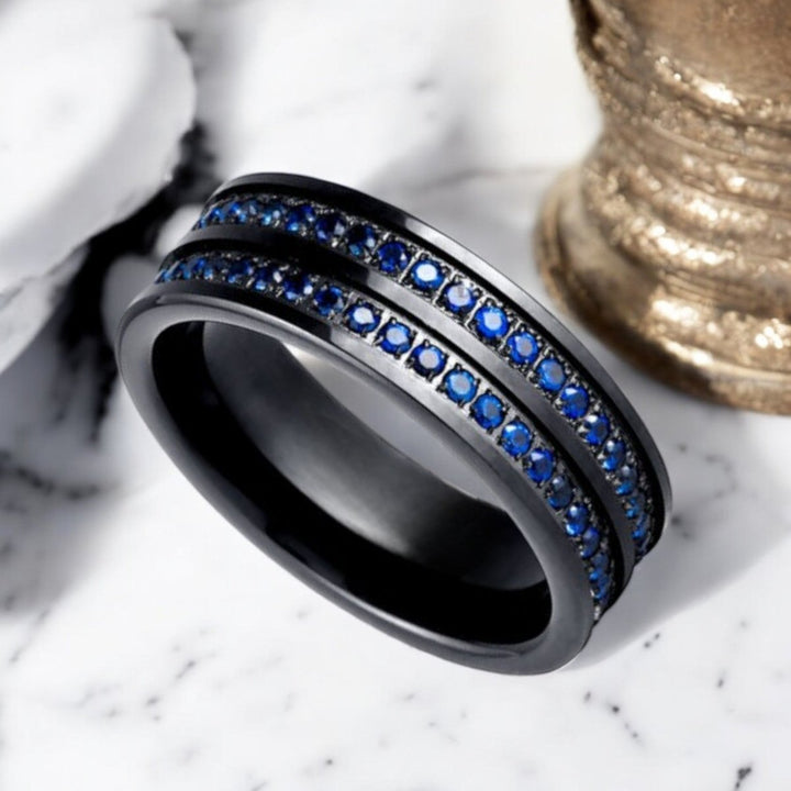 Elegant AZURON Black Tungsten Ring with blue CZ eternity stones.