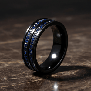 AZURON — Luxury 3/4 angle on dark marble — men's tungsten wedding ring.
