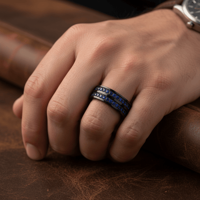 AZURON — Lifestyle photo on hand — men's tungsten wedding ring.
