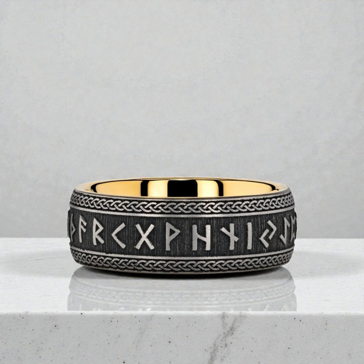 Black tungsten carbide ring showing matte finish and rune detailing