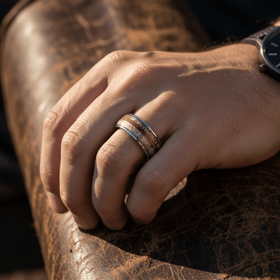 BARRELSTAG — Lifestyle photo on hand — men's tungsten wedding ring.