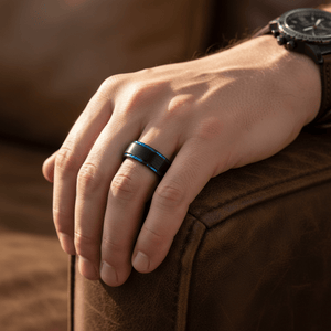 BLIGHT — Lifestyle photo on hand — men's tungsten wedding ring.