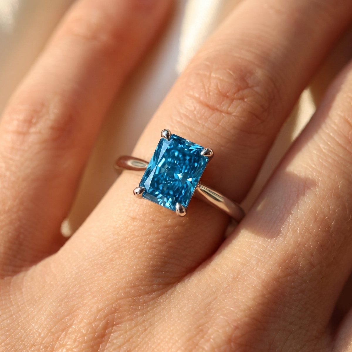Blue Radiant lab-grown diamond solitaire engagement ring, White Gold, on-finger close-up