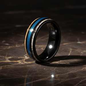 BLUEBARK — Luxury 3/4 angle on dark marble — men's tungsten wedding ring.
