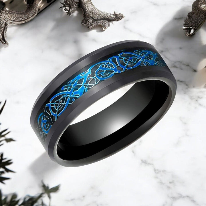 Close-up of BlueKnot tungsten ring with intricate Celtic dragon design.