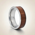 BOKKEN flat silver tungsten wedding band with black walnut wood inlay running around the band and polished silver edges, studio hero shot