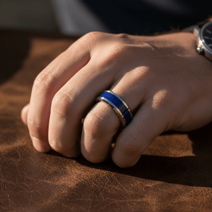 BOYDTON — Lifestyle photo on hand — men's tungsten wedding ring.
