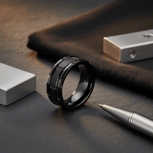 BRICKADE — Editorial masculine still life — men's tungsten wedding ring.