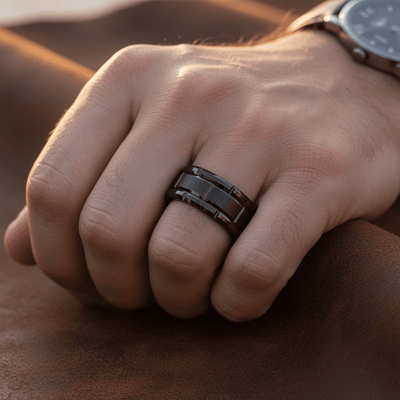 BRICKADE — Lifestyle photo on hand — men's tungsten wedding ring.