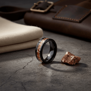 BRONZIUM — Editorial masculine still life — men's tungsten wedding ring.