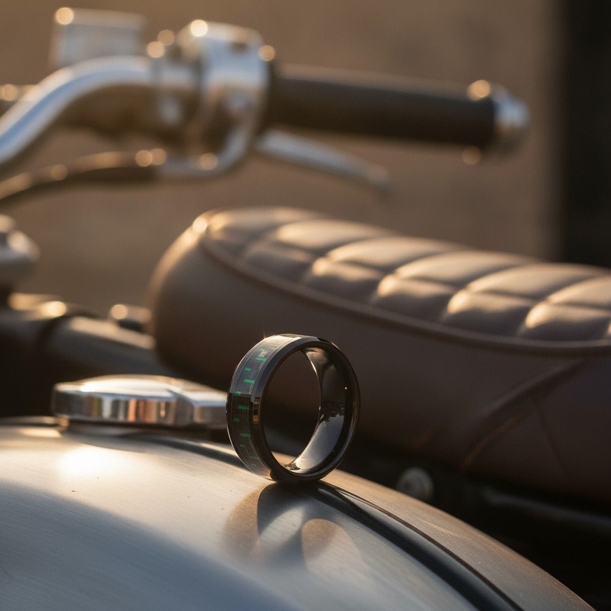 Aydins CARBONOX | Black Tungsten Ring, Green Carbon Fiber Inlay, Beveled lifestyle scene, motorcycle tank