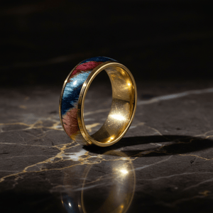 CARVEDEN — Luxury 3/4 angle on dark marble — men's tungsten wedding ring.