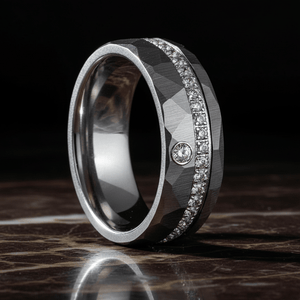 CASCADE — Luxury 3/4 angle on dark marble — men's tungsten wedding ring.