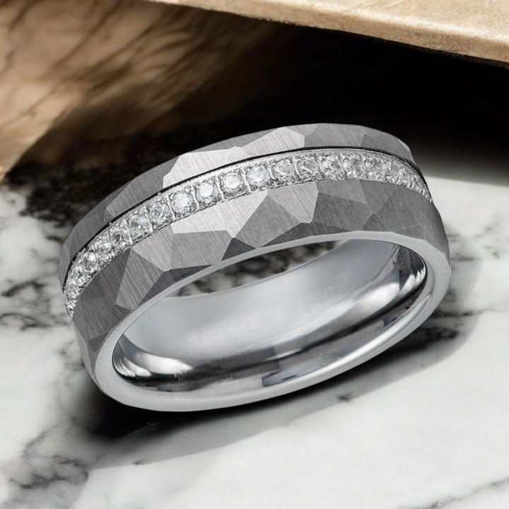 Side profile of CASCADE Ring showing hammered texture and CZ inlay.