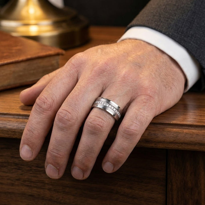 Professional mans ring finger wearing a 8mm CEPHEUS Silver Tungsten Ring - Eternity Wedding Band with CZ Stones