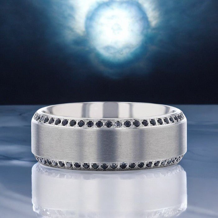 Modern beveled silver titanium wedding band with shimmering black sapphire accents - Aydins Jewelry.