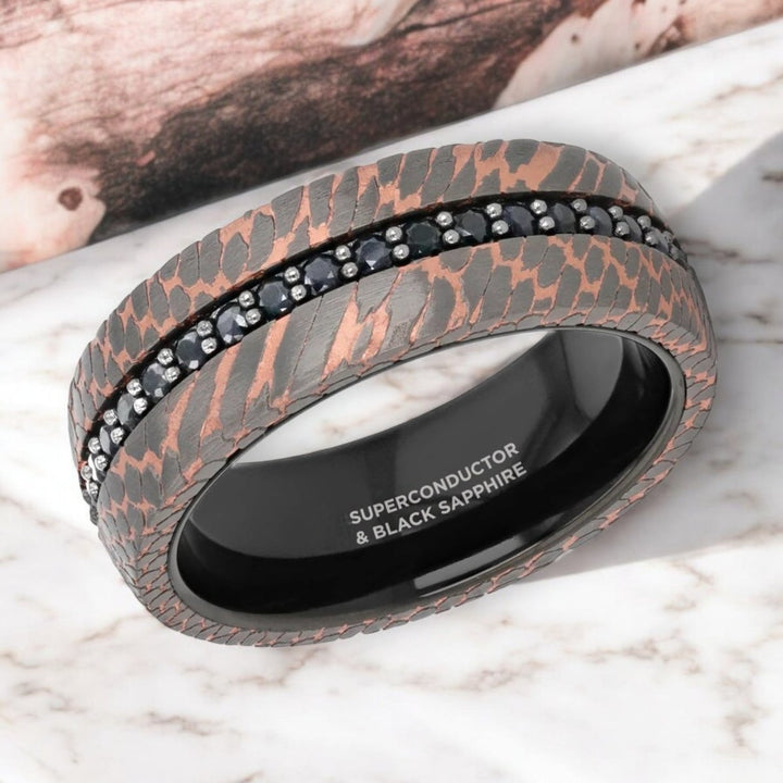 Side view of the CHARGER 8mm Black Tungsten Ring showcasing intricate superconductor texture.