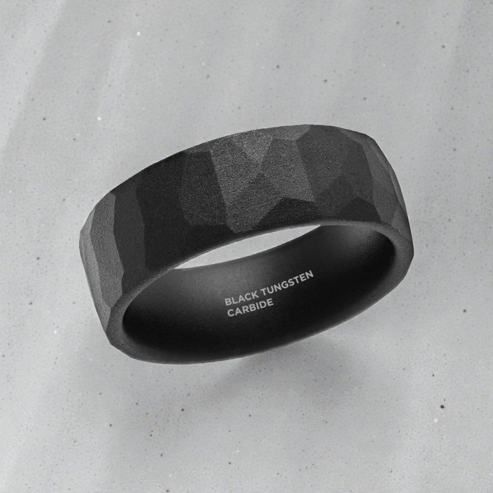 Close up of hammered texture on black tungsten ring