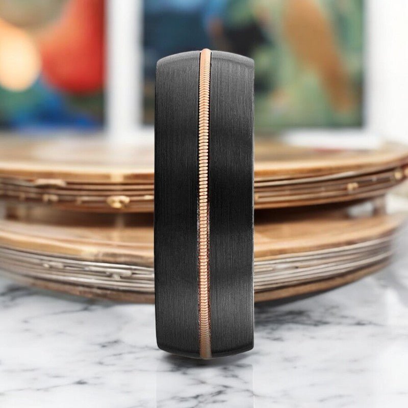 Close-up of the whiskey barrel wood and guitar string inlay on CHORDAL ring.