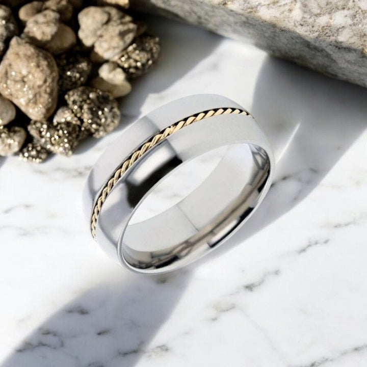 Side view of the CHRISTIAN Silver Titanium Ring showing the luxurious braided gold inlay