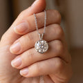 Classic Round Diamond Solitaire Necklace 925 silver lab grown diamond necklace held in hand lifestyle close-up photo