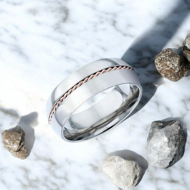 Side view of the CONDUCTOR Silver Titanium Ring showing the intricate braided rose gold inlay