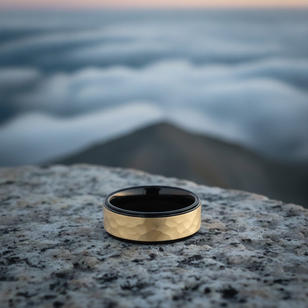 Aydins CREED | Gold-Plated Raised Hammered Black Tungsten Wedding Band 8mm lifestyle scene, granite overlook
