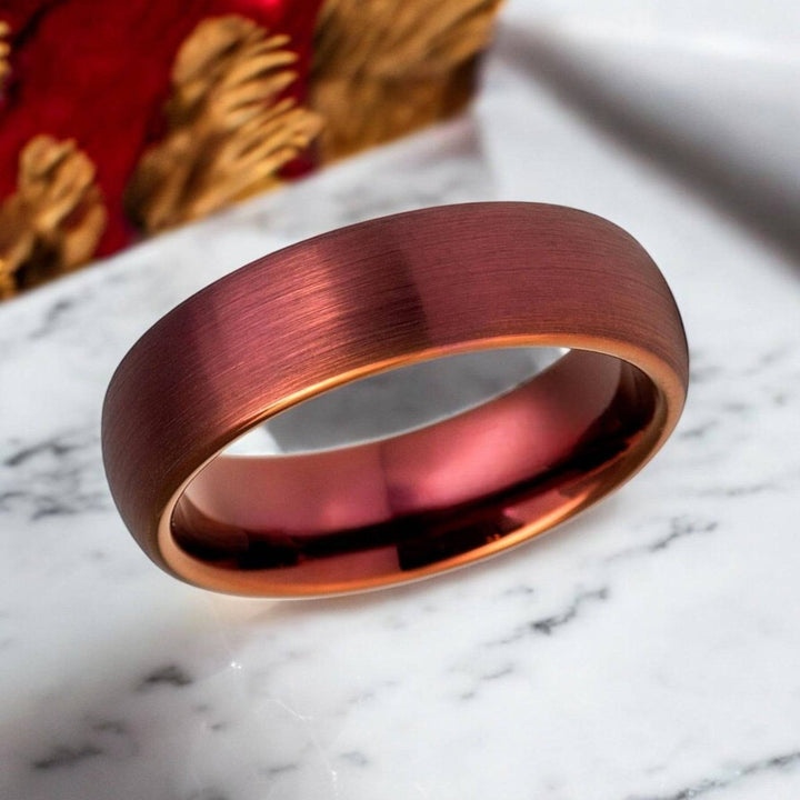 Close-up of the brushed red wine tungsten wedding band in 6mm width.