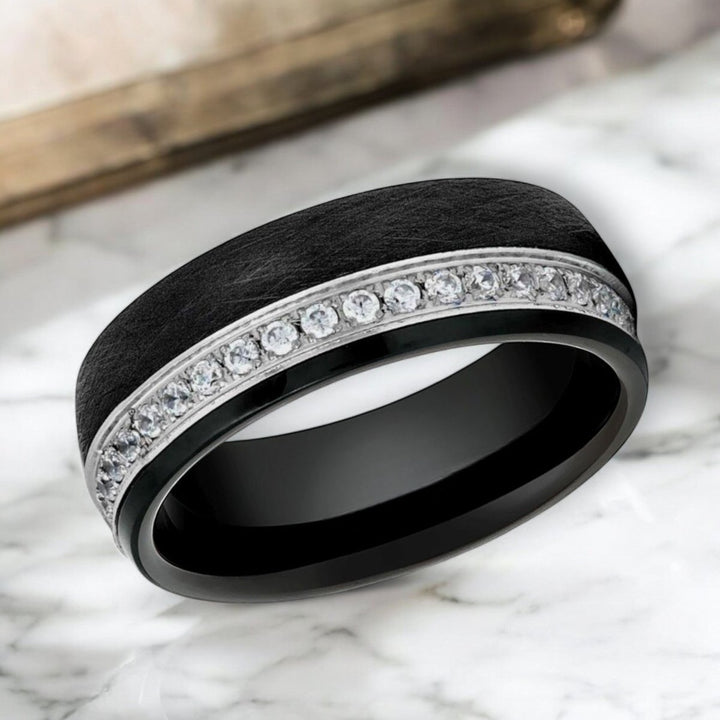 Side view of DAZZEL Black Tungsten Wedding Band showcasing CZ eternity inlay.