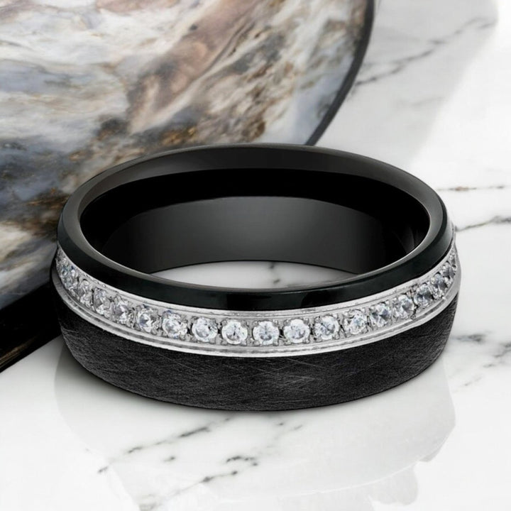 Close-up of DAZZEL 8mm Domed Tungsten Ring with white diamond-stimulated CZ.