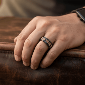 DESERTSTONE — Lifestyle photo on hand — men's tungsten wedding ring.