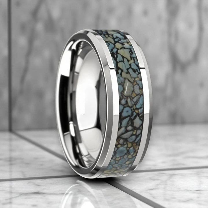 Side view of DEVONIAN tungsten ring with blue dinosaur bone inlay