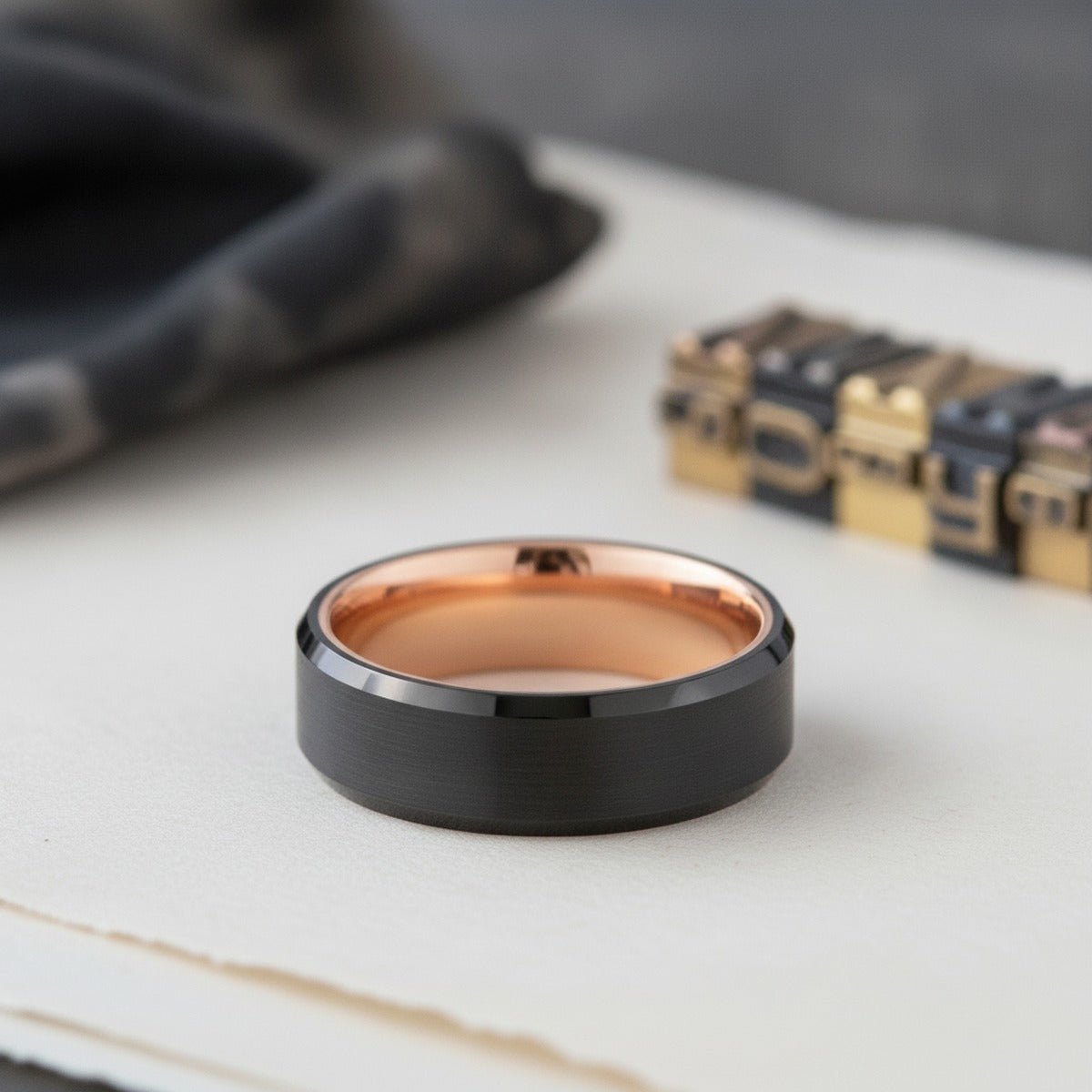 Aydins DIABLO | Rose Gold Ring, Black Tungsten Ring, Brushed, Beveled lifestyle scene, letterpress print