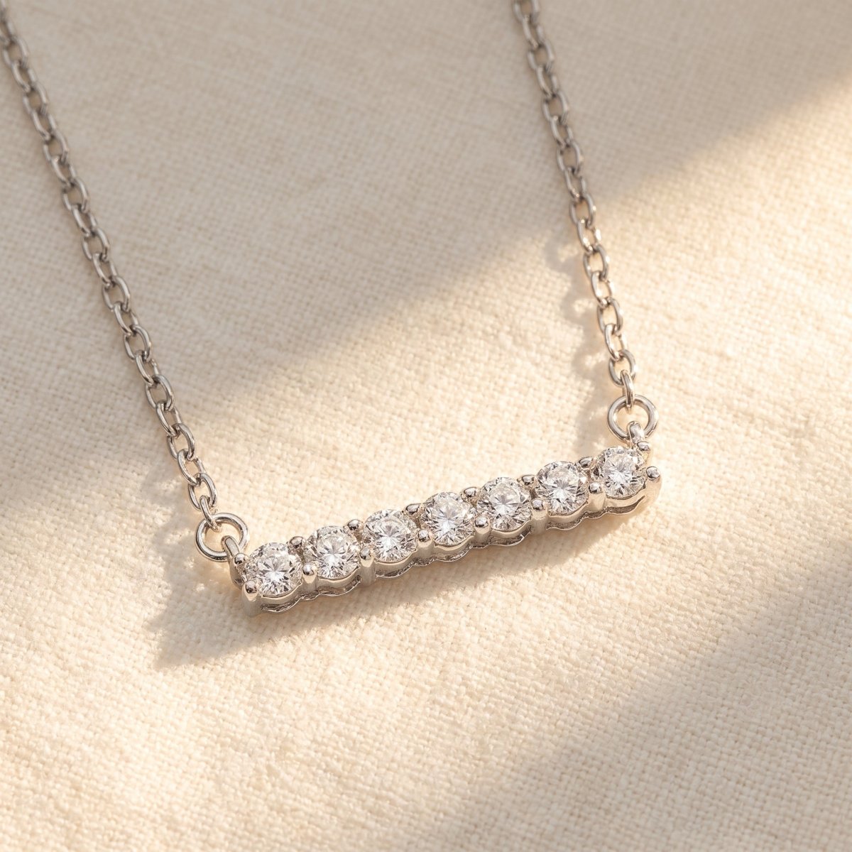 Diamond Bar Necklace With Chain 925 silver lab grown diamond necklace styled flat lay on cream linen