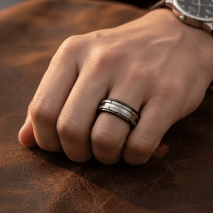 DUALITY — Lifestyle photo on hand — men's tungsten wedding ring.