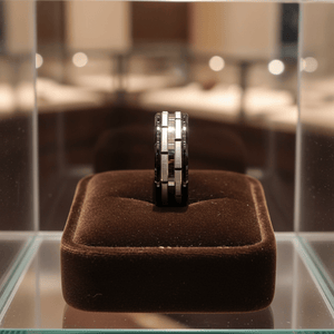 DUALITY — Premium boutique display on velvet — men's tungsten wedding ring.