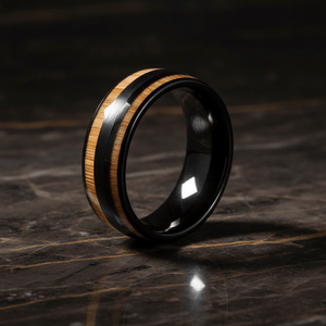 DUNLAP — Luxury 3/4 angle on dark marble — men's tungsten wedding ring.