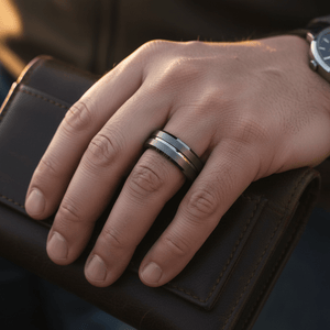 ECHORIDGE — Lifestyle photo on hand — men's tungsten wedding ring.